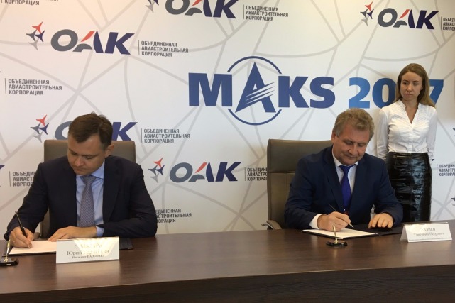 Rospatent G. Ivliev and OAK Y. Slyusar sign agreement